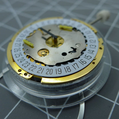 Swiss Made ISA 8171 quartz watch movement with date display at 6, multifunctional and precise mechanism.