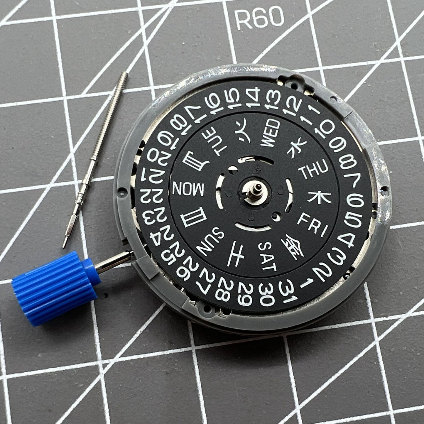 Miyota NH36A watch movement with black finish, green lume, and 3 crown positions for precise time setting.