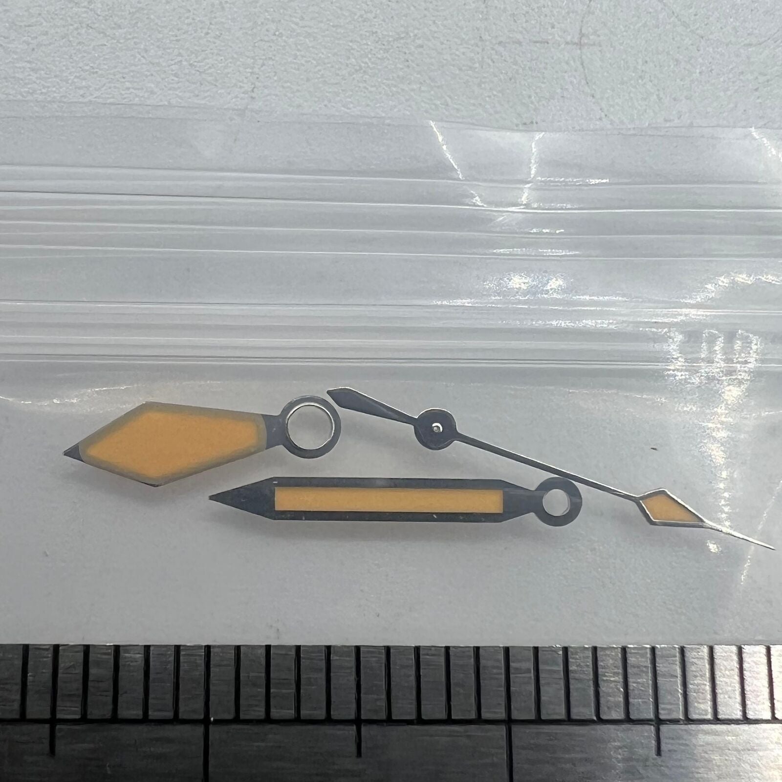 Vintage diamond-shaped watch hands with orange and green lume, silver trim for NH35/NH36.