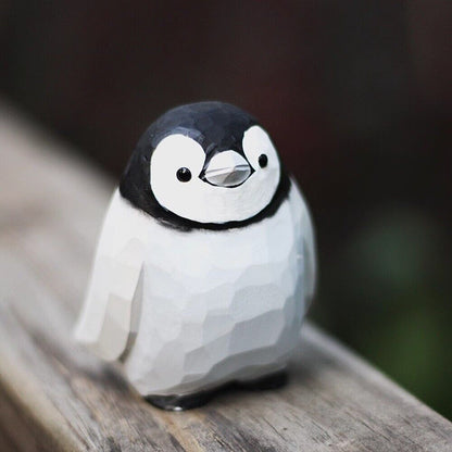 Handmade Little Penguin wooden figurine, detailed collectible sculpture for home decor.