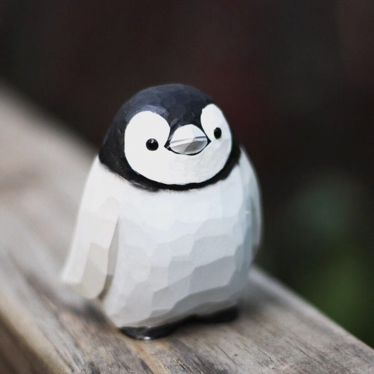 Handmade Little Penguin wooden figurine, detailed collectible sculpture for home decor.