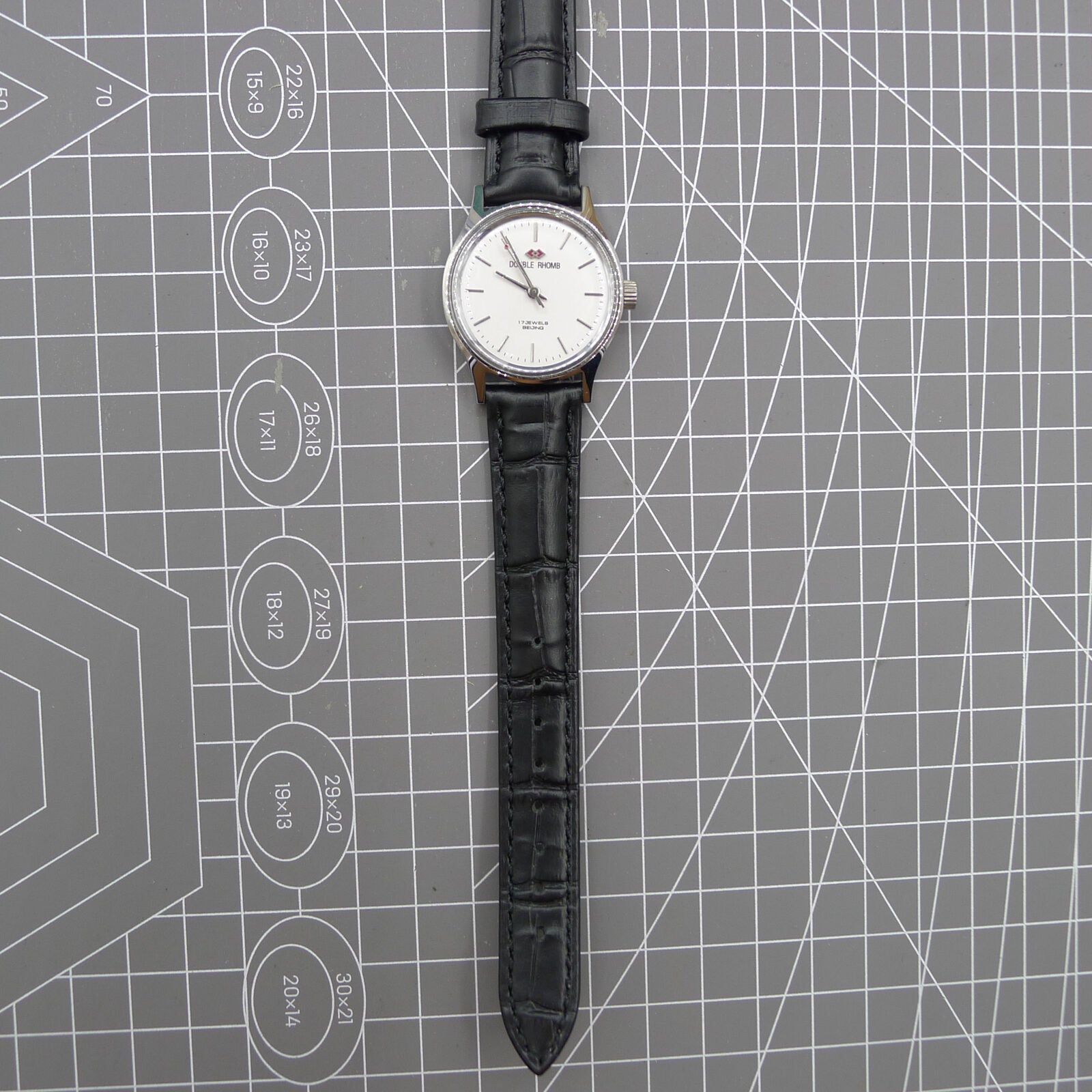 Silver 31mm Beijing Double Rhomb manual watch with three hands, elegant design for classic style.