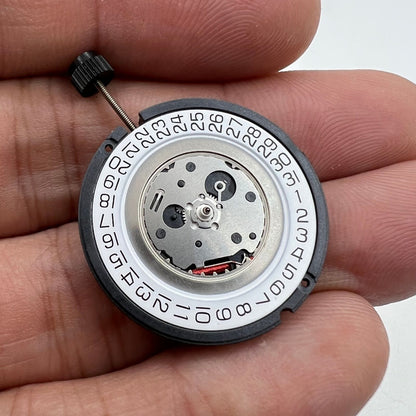 Swiss Made ETA 805.112 quartz watch movement with 3 hands and date display at 3 o'clock.