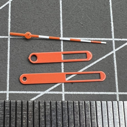 15mm Hollow orange and white trimmed watch hands for Ronda 515 movement, precise and stylish.