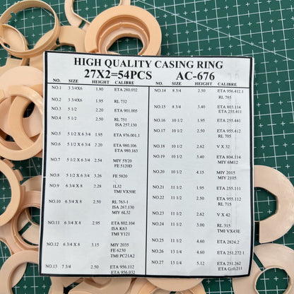 Set of 54 AC-676 watch movement case spacers, various 27 ligne sizes for precise watch repairs