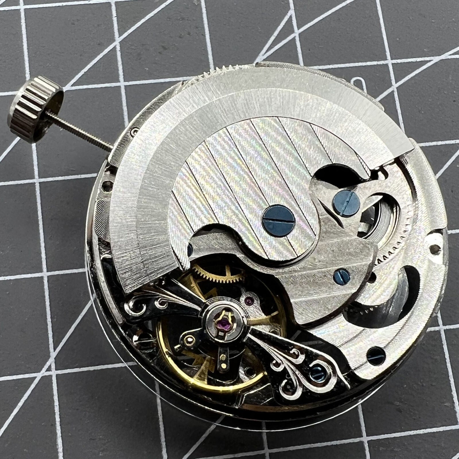 Double Mainspring watch accessory featuring hollow mechanical movement and dual time zone functionality for stylish timekeeping.