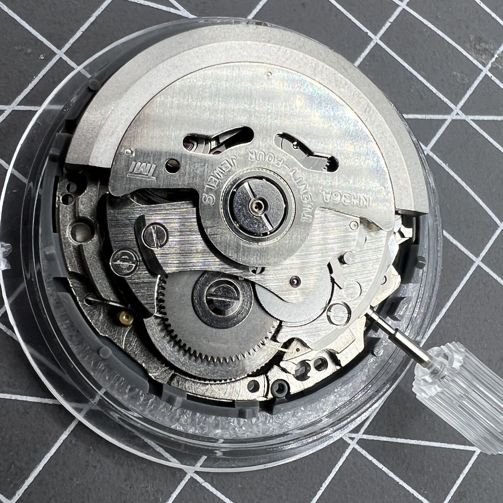 NH36 automatic watch with black Arabic dial, date display, and 3.8 crown position.