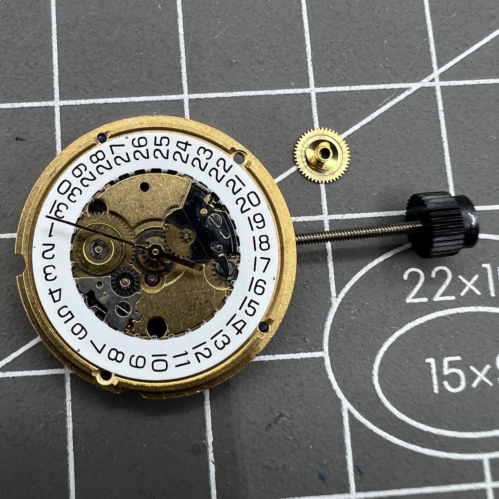 ETA 956.412 quartz watch movement with 3 hands and date display at 3 o'clock, precision timekeeping.