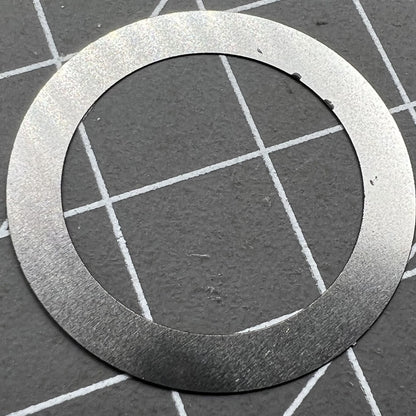 Close-up of Grey Character Date Disk for Seiko NH35 NH36 watch movement on black background.
