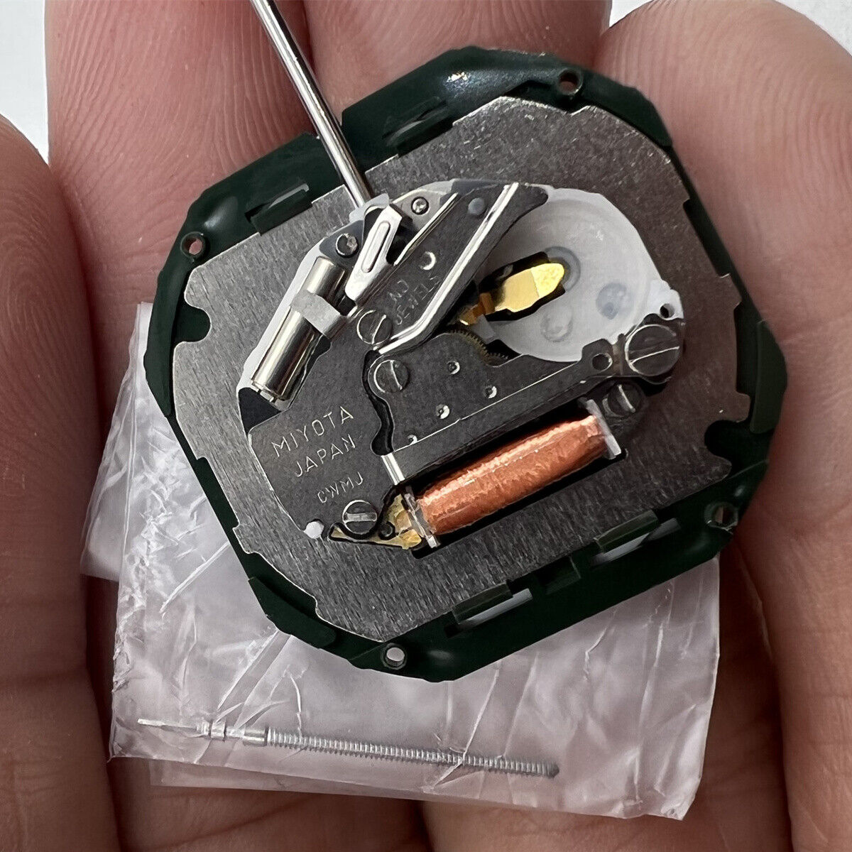 Quartz Miyota 2350 watch movement with day date, 3 hands, precise timekeeping for watch repairs.