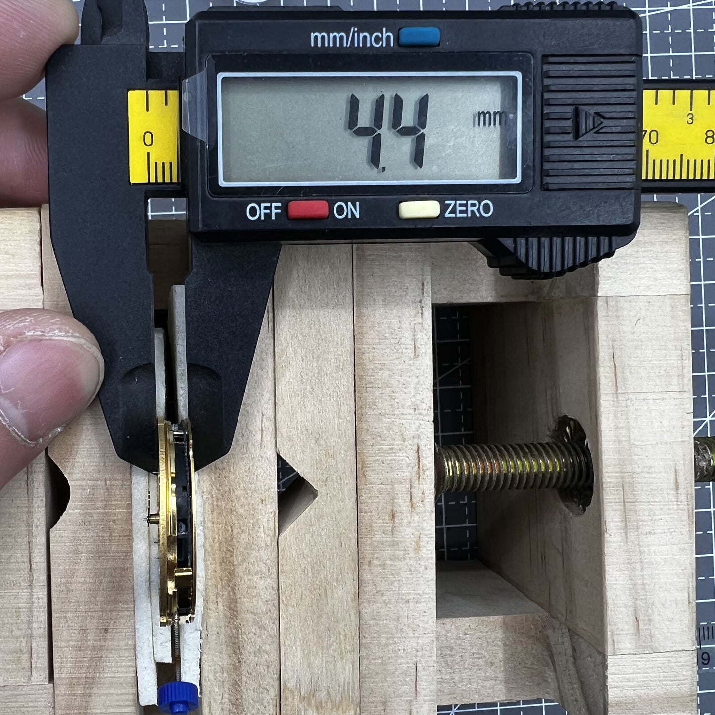 Swiss Made Ronda 5030D quartz movement with black date disk at 4 o'clock for precise watch repair.