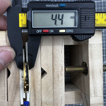 Swiss Made Ronda 5030D quartz movement with black date disk at 4 o'clock for precise watch repair.