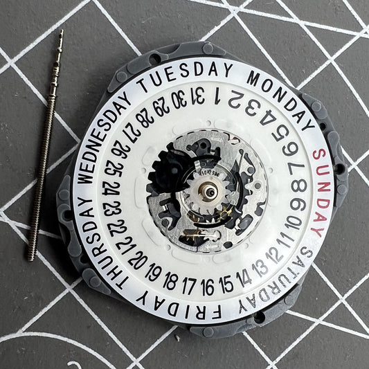 Hattori Epson TMI VJ55 quartz watch movement with date at 6, precision Japan-made component.