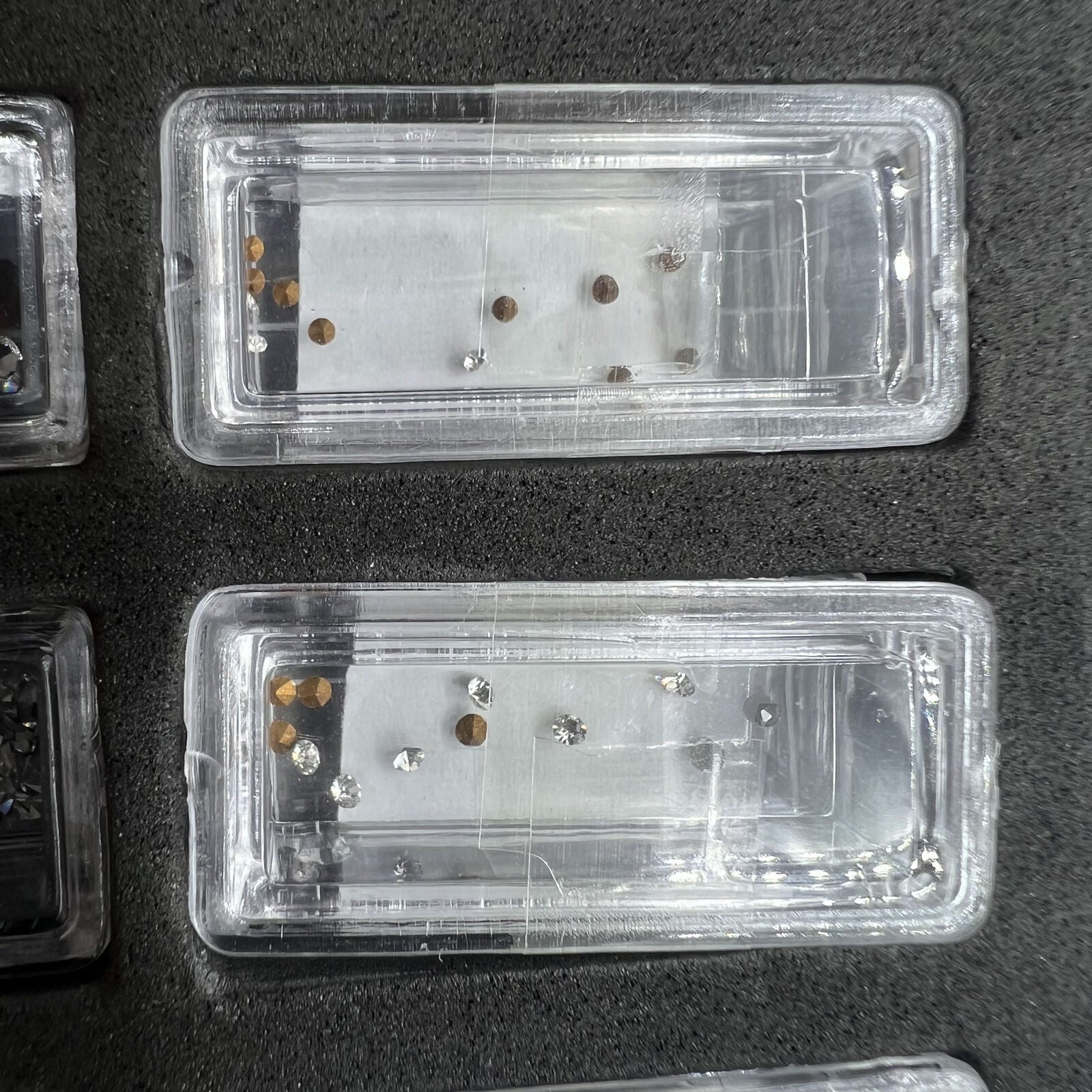 Set of 144 artificial glass stones in 12 sizes for watch dial and case decoration, enhancing style with quality craftsmanship.