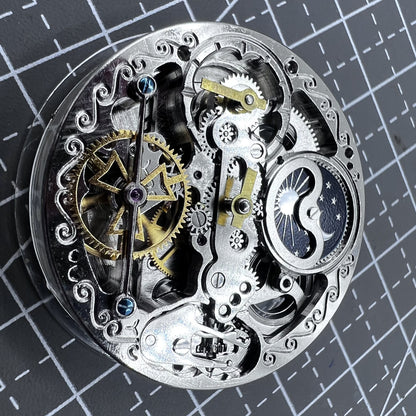 Small silver hollow watch movement with double mainspring and balance wheel at 6 o?clock by Kleines brand.
