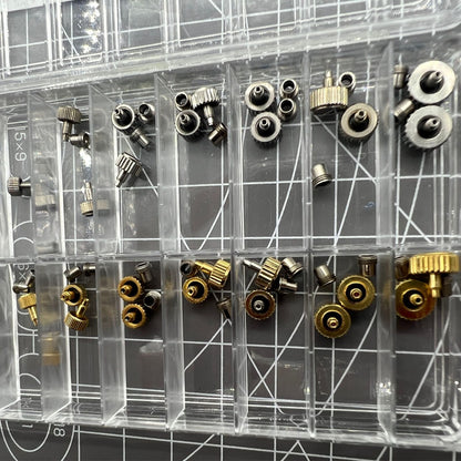 Stainless steel watch crown with dual silver and gold tones, screw-on tube, and gasket for secure fit.