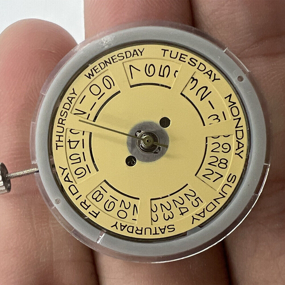 Asian Tianjin Seagull T16 watch with golden dial, day-date display, and automatic mechanical movement