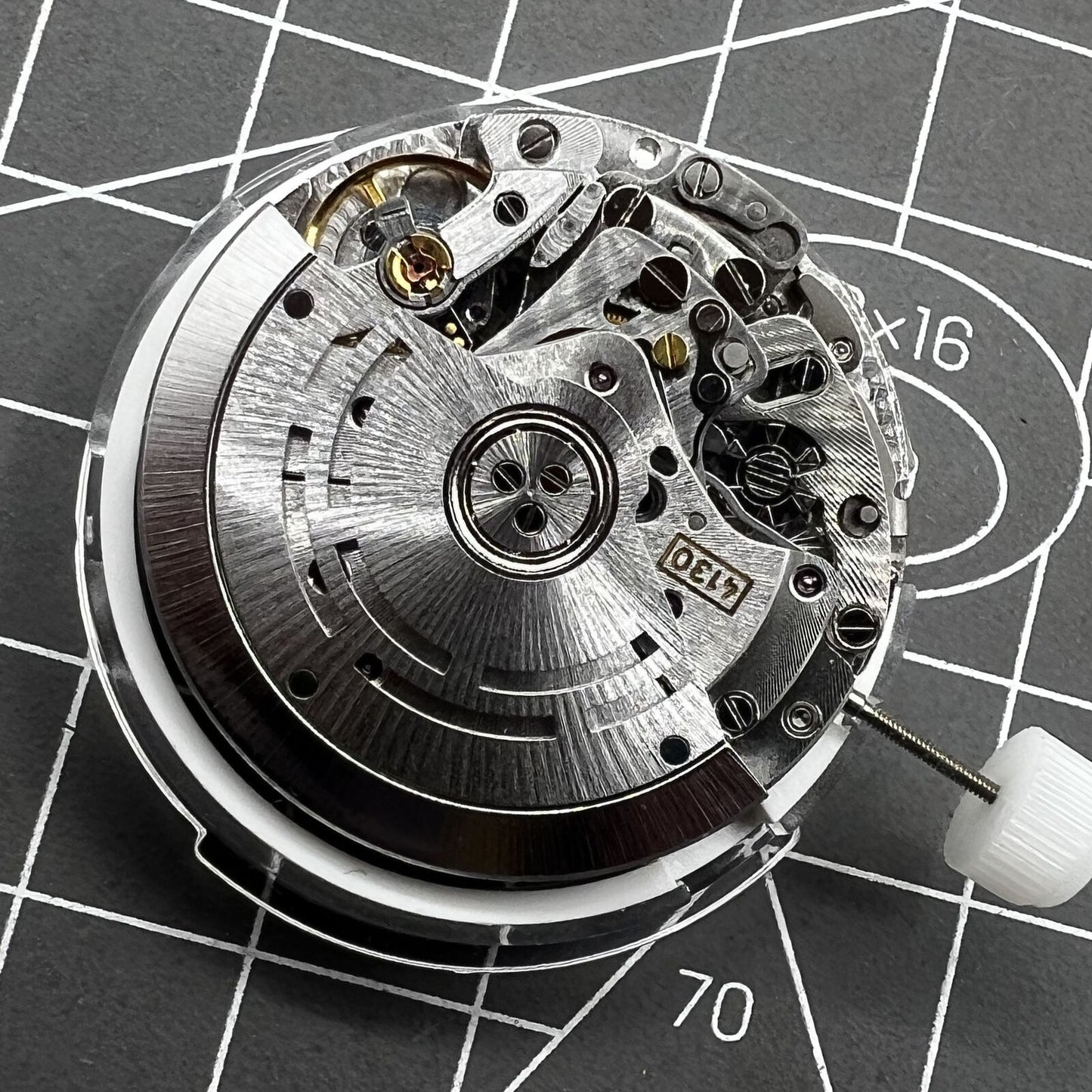 Chinese 4130 automatic watch movement displaying multifunctional small seconds at 3, 6, and 9 o'clock.