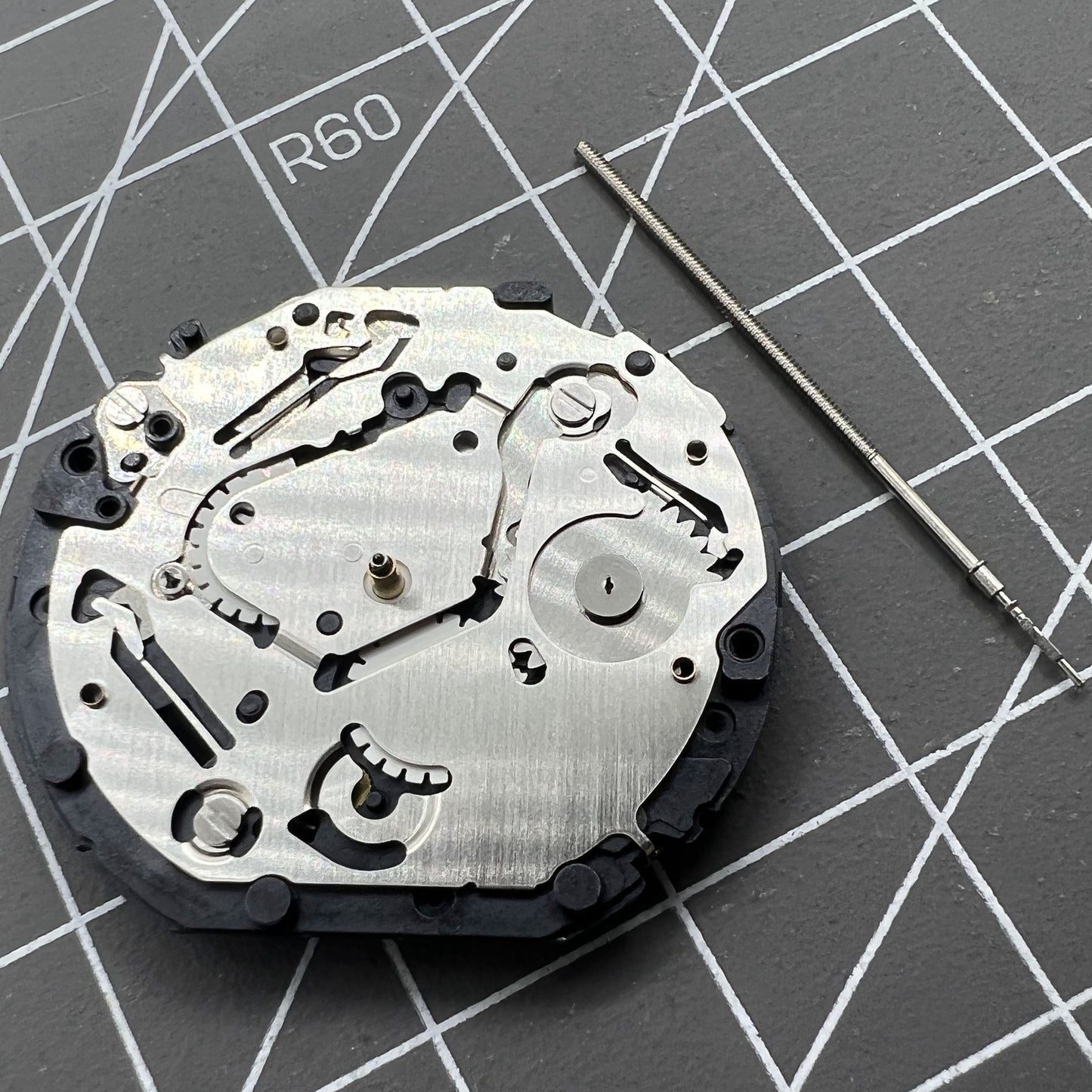 Japan Made Hattori Epson TMI VX7P VX7PE quartz watch movement, precise timekeeping component.