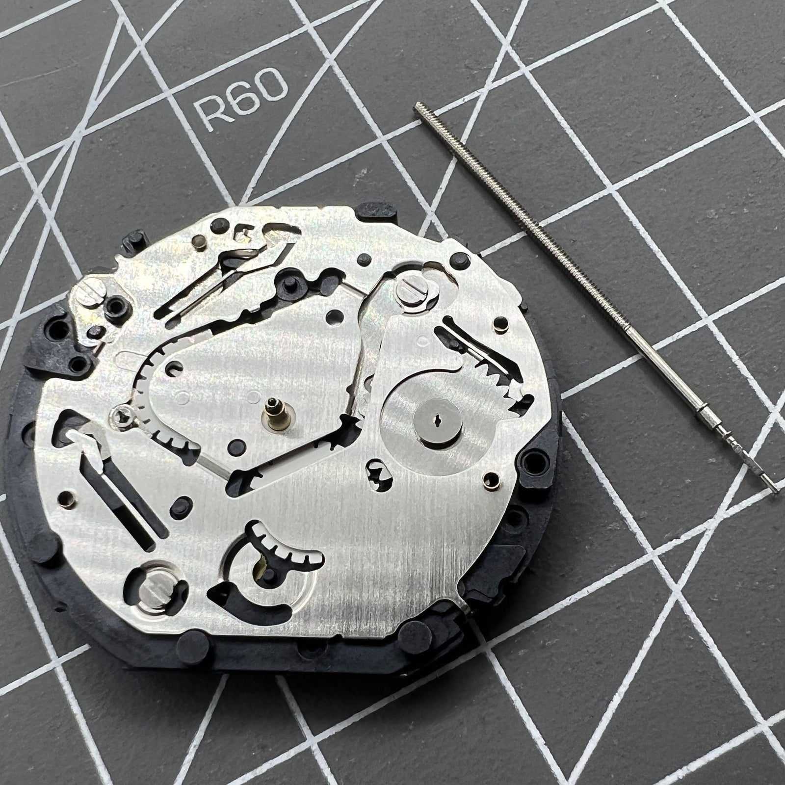 Japan Made Hattori Epson TMI VX7P VX7PE quartz watch movement, precise timekeeping component.