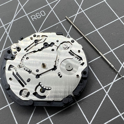 Japan Made Hattori Epson TMI VX7P VX7PE quartz watch movement, precise timekeeping component.