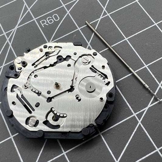 Japan Made Hattori Epson TMI VX7P VX7PE quartz watch movement, precise timekeeping component.