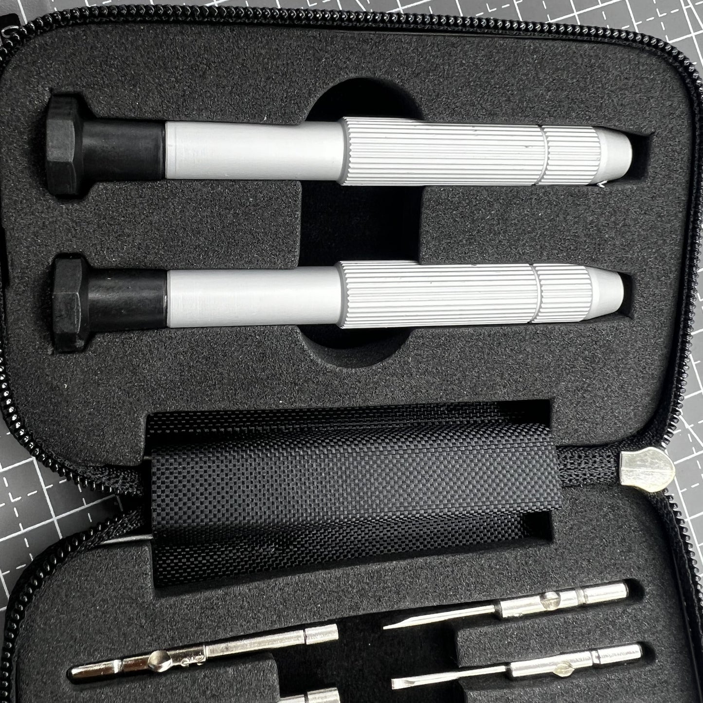 Precision screwdriver set with hex tools for watches and glasses repair, ergonomic grip.