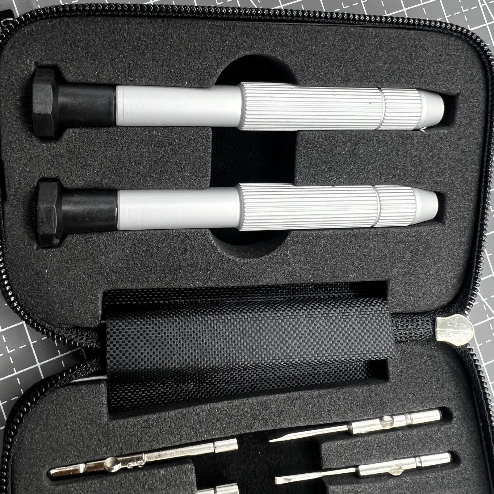 Precision screwdriver set with hex tools for watches and glasses repair, ergonomic grip.