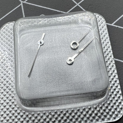 Silver watch hands set for ETA 956.112 movement, including hour, minute, and second hands.