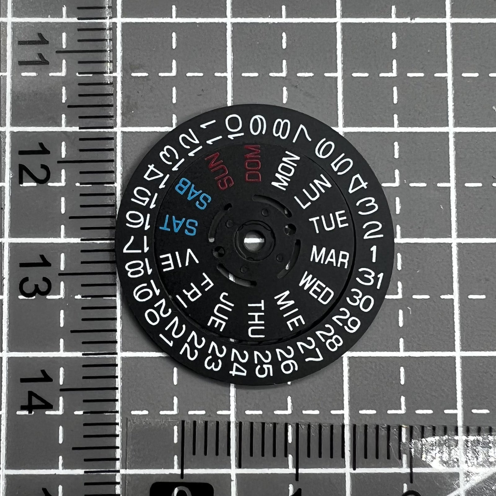 Black watch accessory showing date and day wheel at 3 o'clock crown for Seiko NH36 movement.