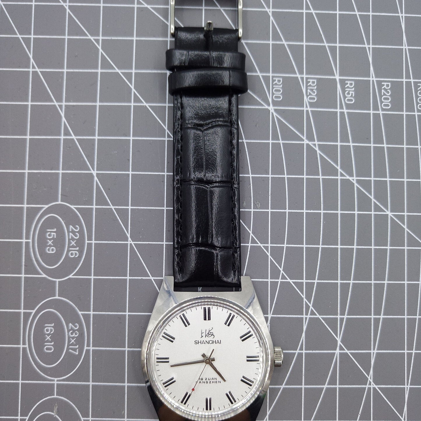 Shanghai Factory 38mm manual mechanical watch with white dial, 3 hands, 19 jewels, classic design.