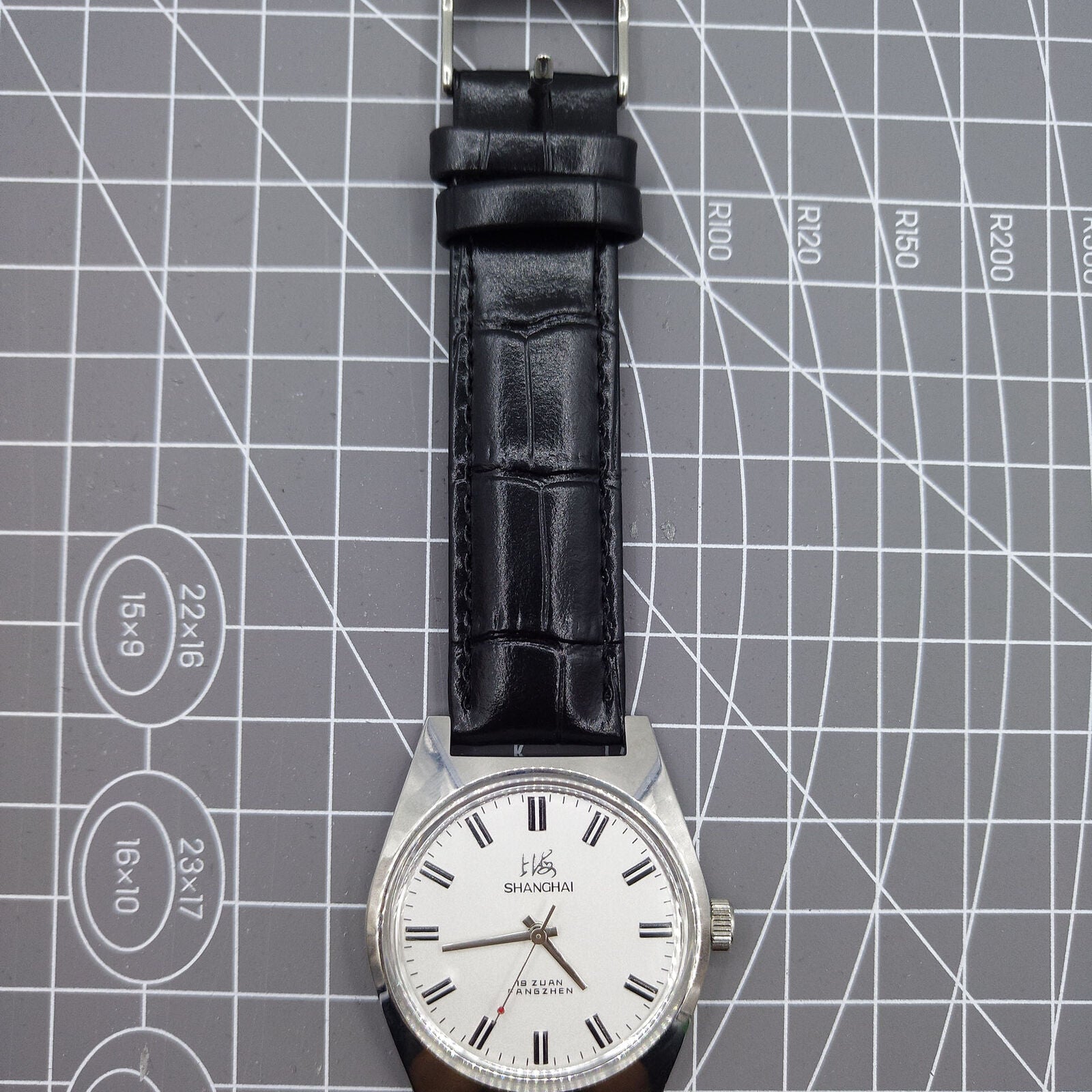 Shanghai Factory 38mm manual mechanical watch with white dial, 3 hands, 19 jewels, classic design.