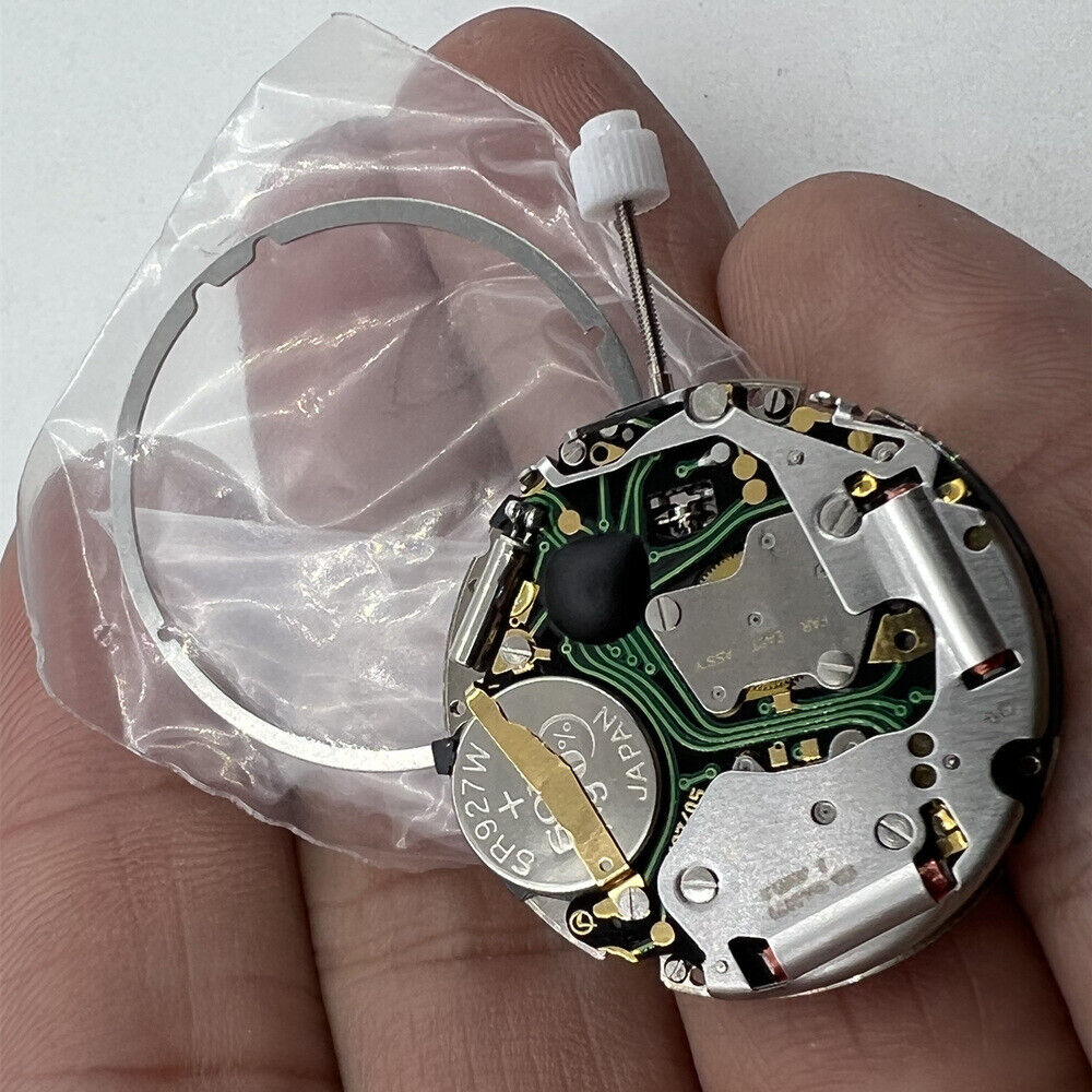 ISA 8171 silver quartz watch movement with date at 6, multi-function repair part for precision timepieces.