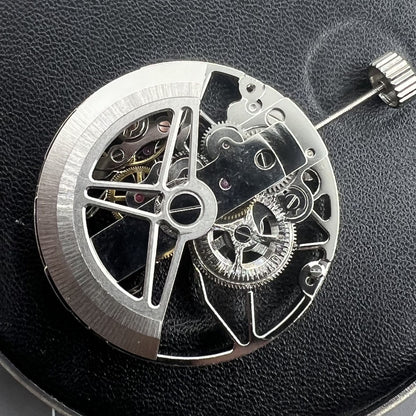 Dandong 8306 silver watch with hollow dial and automatic movement, showcasing elegant style for daily wear.