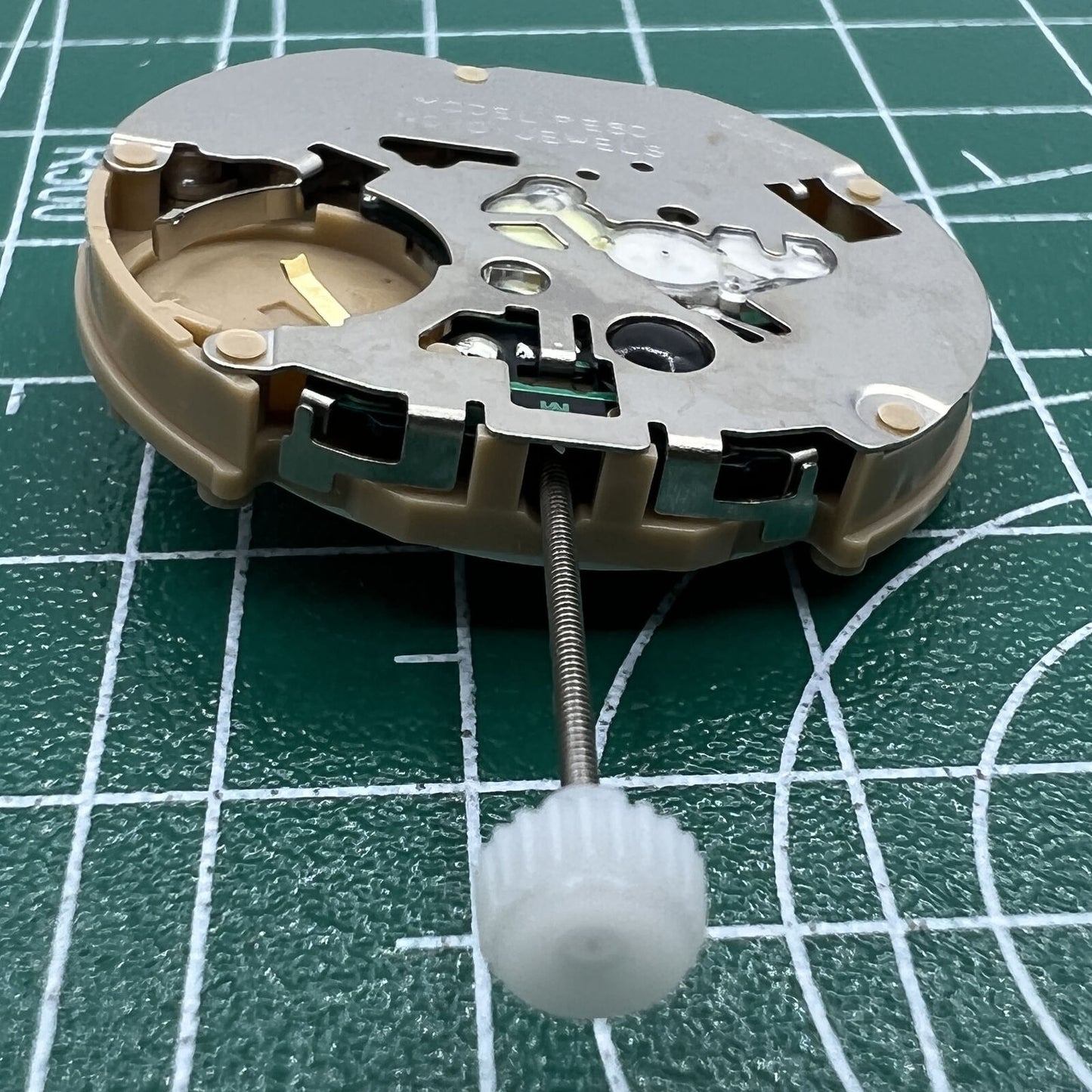 Sunon PE60 quartz watch with date at 3, small seconds at 6, and classic 3-hand design.