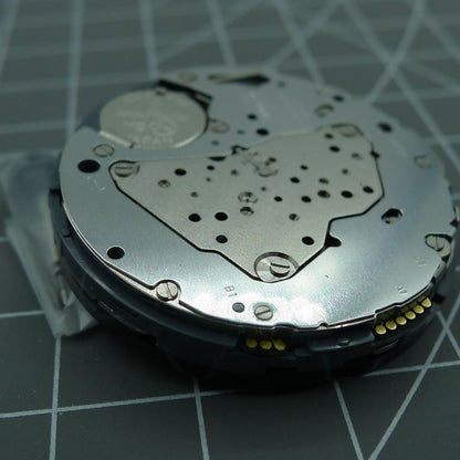 Miyota 6S50 quartz watch movement showing date at 12, three hands, and small seconds on subdials at 3, 6, 9.