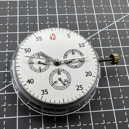 Dandong 7750 mechanical watch movement displaying small seconds subdials at 3, 6, and 9 o?clock, no calendar.
