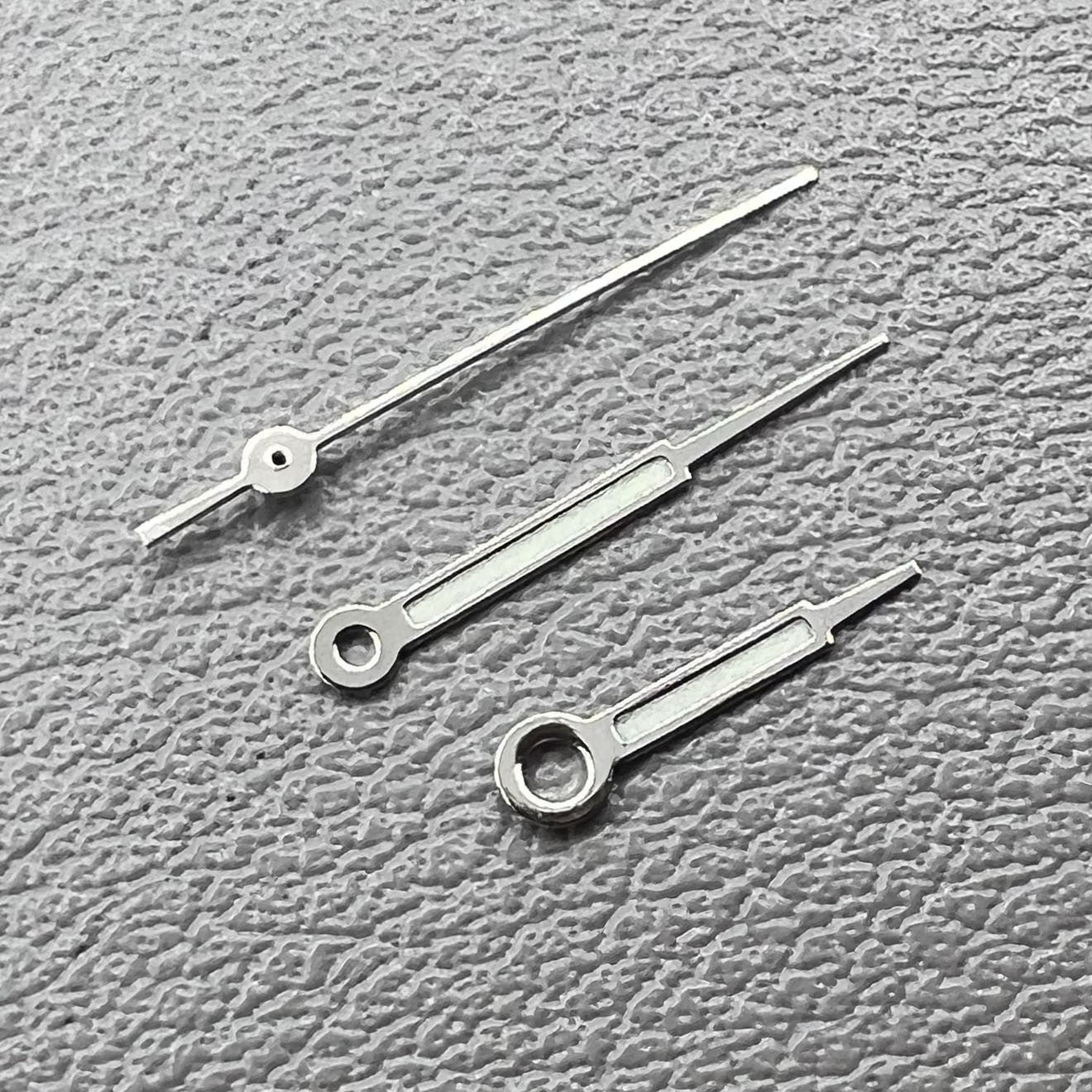 Set of silver trim green lume pointed hands for Ronda 515 watch movement, perfect for precise time reading.