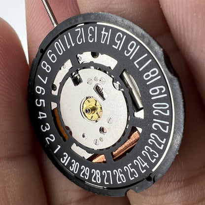 Swiss Part Ronda 715 quartz watch movement with black date wheel positioned at 6 o'clock for precise timekeeping.