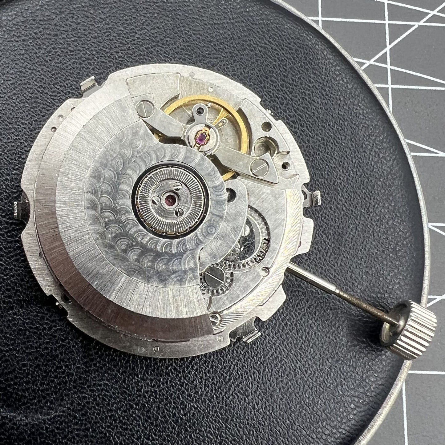 Tianjin Seagull ST25 automatic watch movement displaying 3 hands and big date, showcasing precise Chinese craftsmanship.
