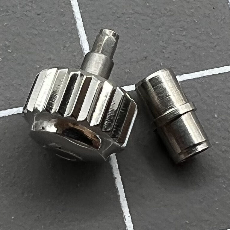 Polished 6.3mm silver OMEGA Seamaster 300 watch crown with tube, precision replacement accessory for secure fit.