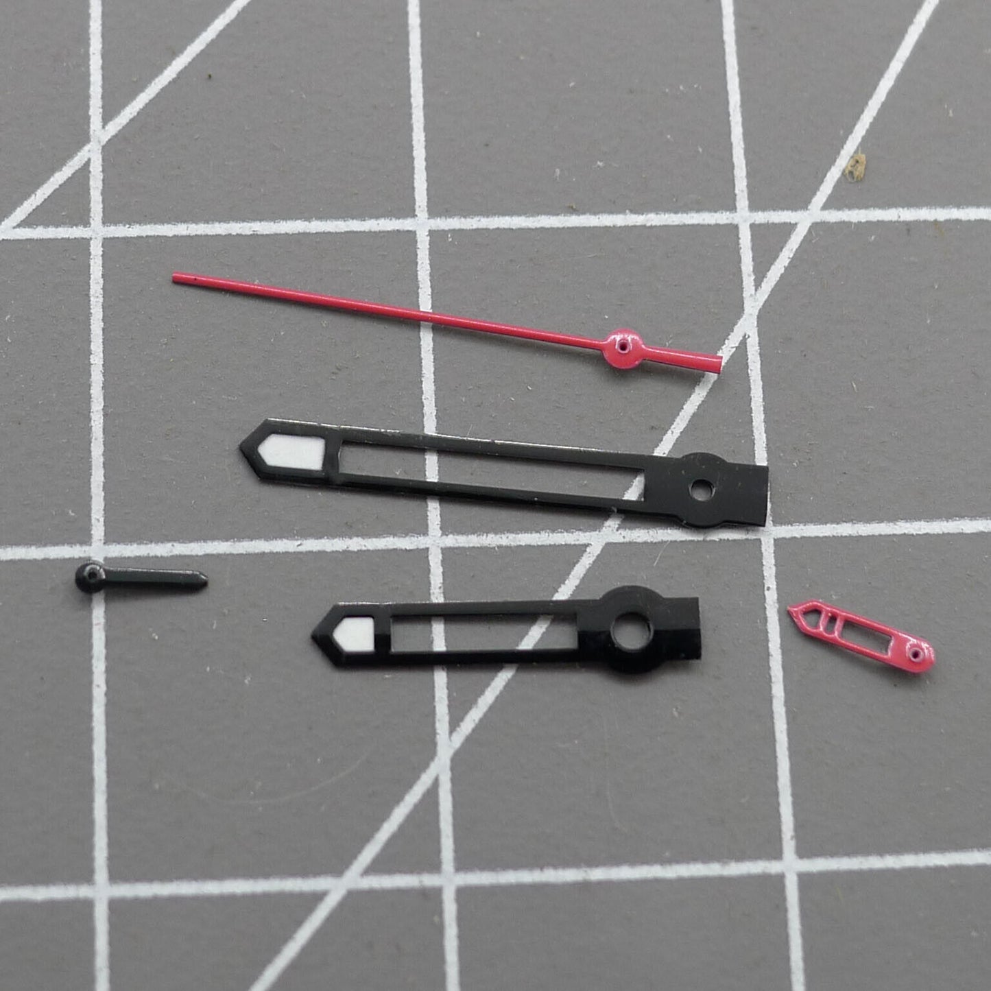Black-trimmed red second hand for Hattori Epson VD53 quartz watch movement, precise accessory.