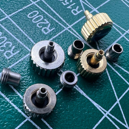 Stainless steel watch crown with silver and gold finish, screw-on tube and gasket by Durable brand.