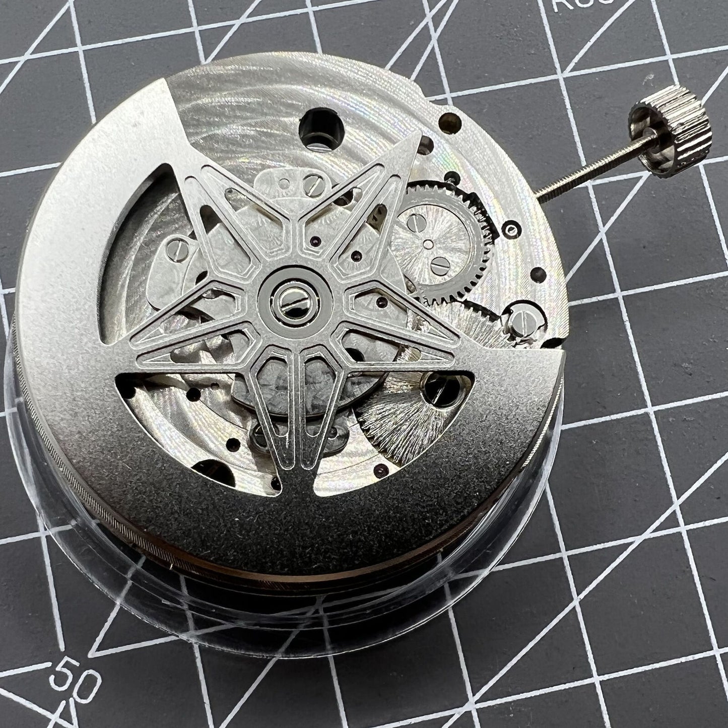 Dandong Silver Hollow Star Moon Phase watch showcasing automatic mechanical movement and elegant silver design by China Made.