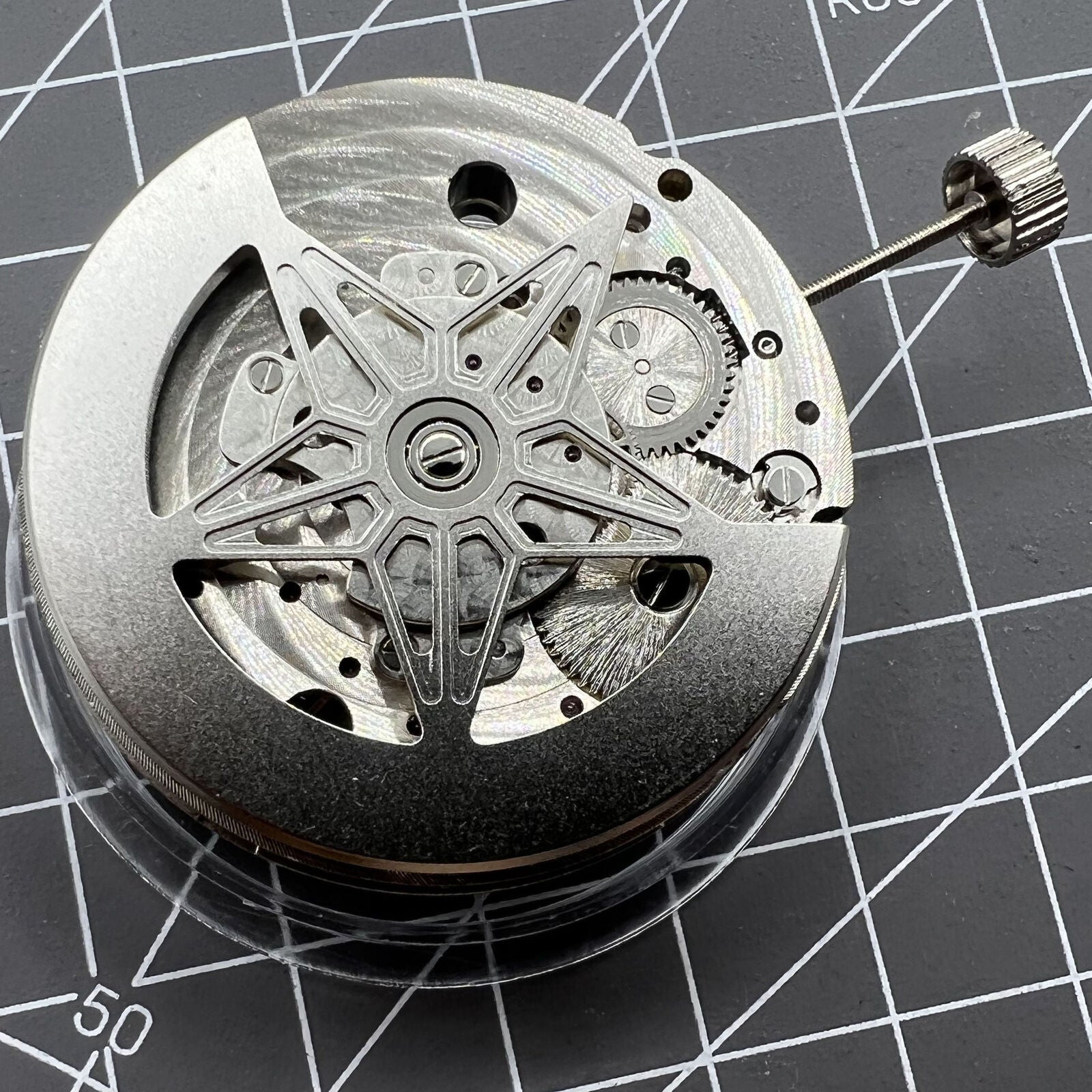 Dandong Silver Hollow Star Moon Phase watch showcasing automatic mechanical movement and elegant silver design by China Made.