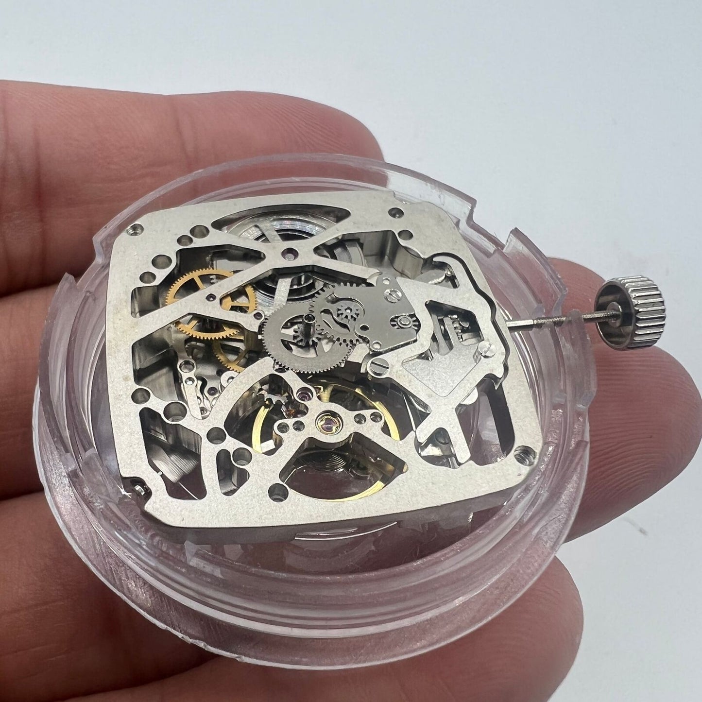 Tianjin Seagull ST25 automatic mechanical square watch movement, silver with 3 hands and hollow design.