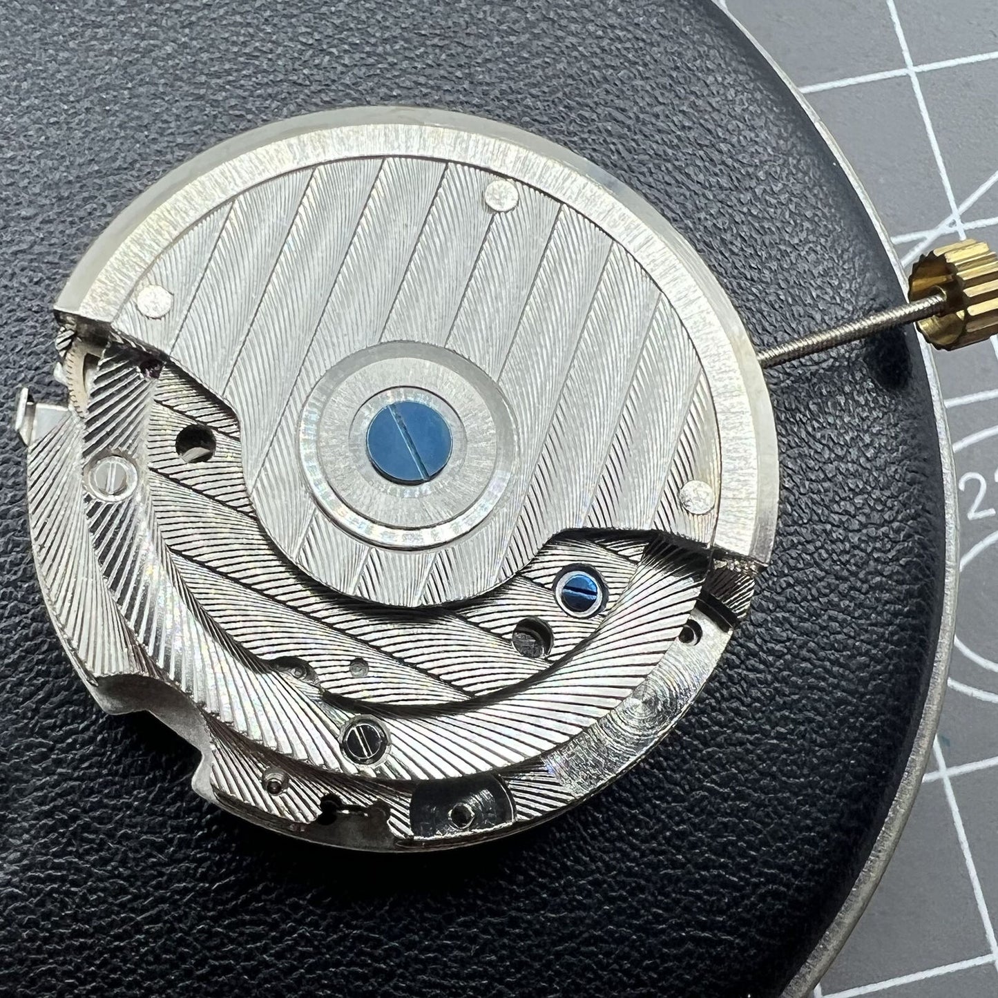 Automatic mechanical watch featuring reversed balance wheel and large date display at 12.