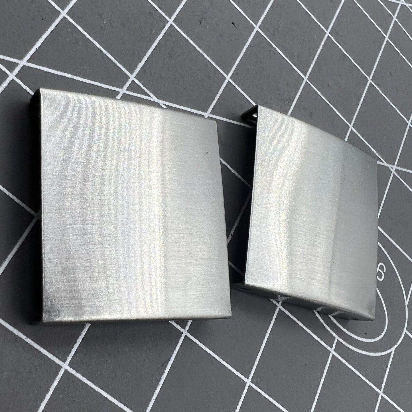 Silver 3-fold watch strap buckle extender, 18 pieces in 9 sizes for precise bracelet adjustments.