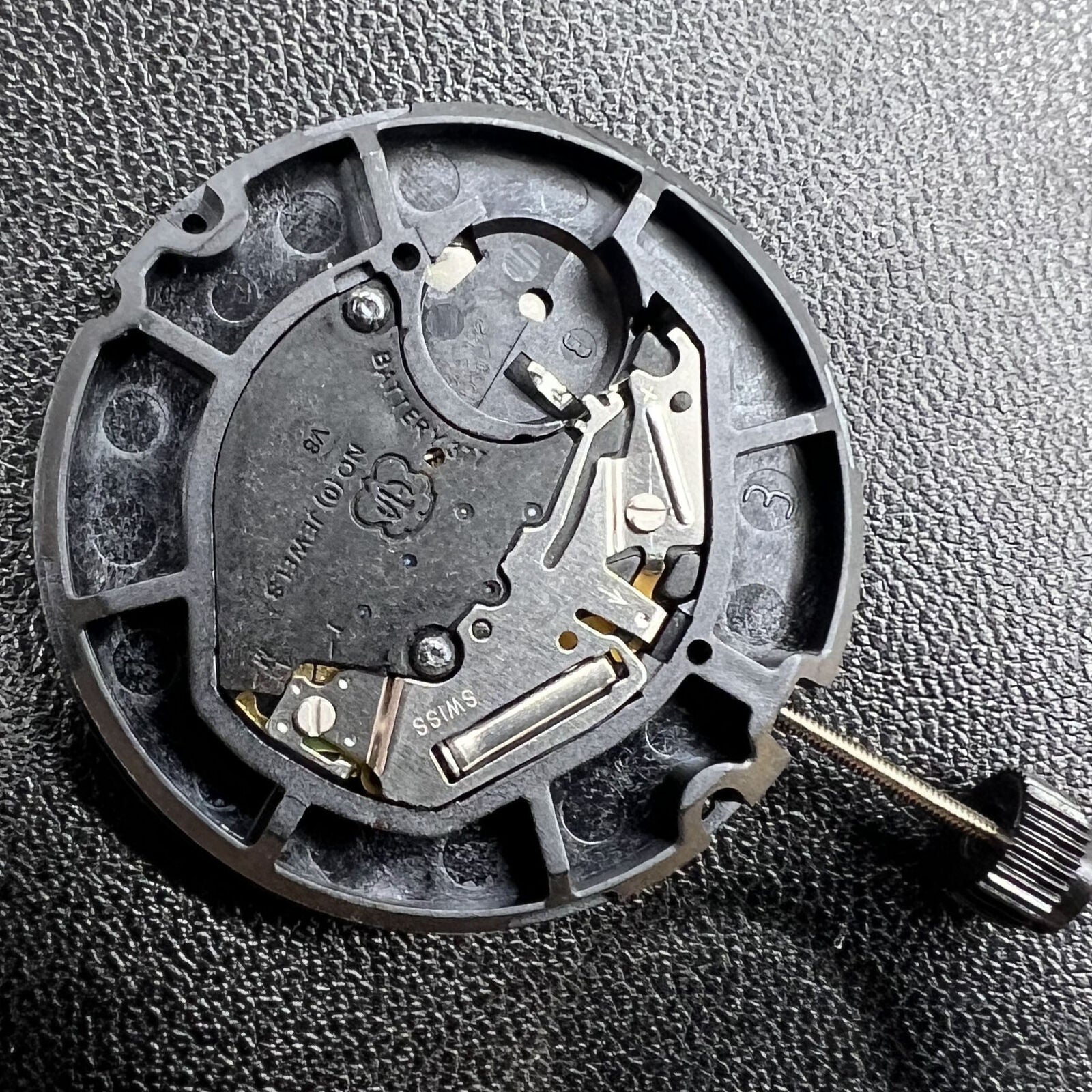 Swiss Made ETA 805.122 watch with quartz 3 hands, day/date display, showcasing precise Swiss movement craftsmanship.