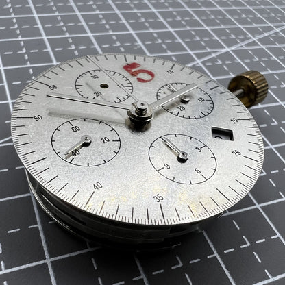 Dandong 7753 automatic watch movement with small second dial at 9 o'clock for precise timekeeping.